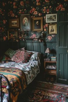 a bed sitting in a bedroom next to a wall covered in pictures and flowers on the walls