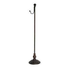 an old fashioned metal umbrella stand on a white background