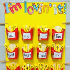 i'm loving it bulletin board with paper cutouts and words on the front