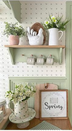 the shelves are decorated with flowers and teacups on top of each other,