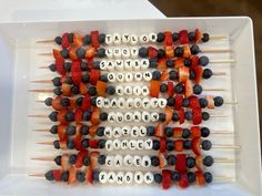 several skewers are arranged in the shape of an american flag with fruit on them