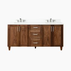 a bathroom vanity with two sinks and wooden cabinets