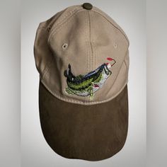 a baseball cap with an alligator embroidered on it