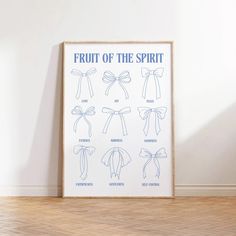 the fruit of the spirit poster is displayed in front of a white wall and wooden floor