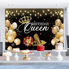 a birthday party scene with balloons, cake and gold shoes on the table in front of a black background