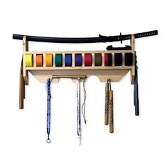 a wooden rack with many different colors of thread and scissors hanging from it's sides