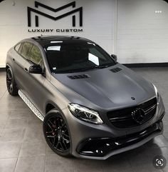 a mercedes cla is parked in a showroom