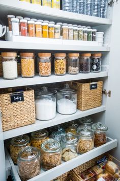 a pantry filled with lots of different types of food and containers on the bottom shelf