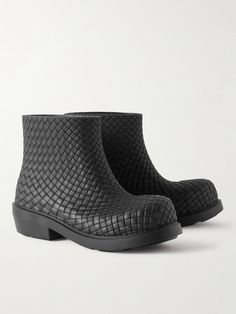 Bottega Venetta’s rubber boots are debossed to look like the house's signature intrecciato weave. They're grounded on gripped chunky soles that'll keep you steady on slick surfaces. Rubber Boots For Men, Luxury Gore-tex Boots With Vibram Sole, Luxury Gore-tex Boots With Reinforced Toe, Black Waterproof Boots With Vibram Sole And Gore-tex Material, Black Gore-tex Boots With Reinforced Toe, Bottega Veneta Tire Boots Men, Bottega Veneta Boots, Leather Outerwear, Boots For Men