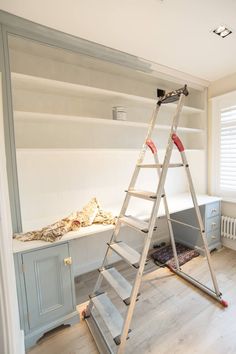 a ladder that is sitting in the middle of a room