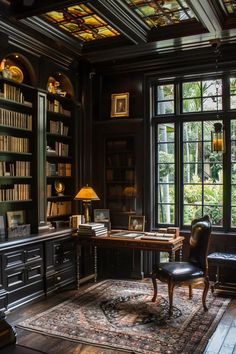 a room with many bookshelves and chairs around a table in front of a large window