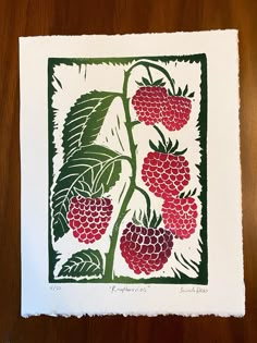 a drawing of raspberries on a white paper with green leaves and red berries