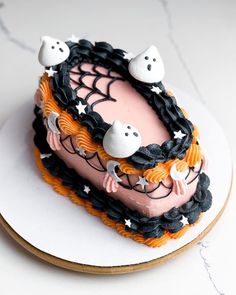 a decorated cake with spooky ghost decorations