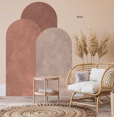 a living room with an area rug, chair and table in front of the wall