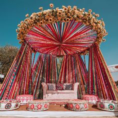 an elaborately decorated stage set up for a wedding