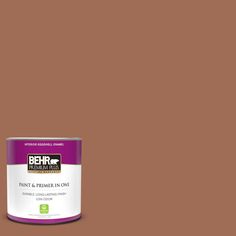 a can of behr paint and primer in one on a dark blue background