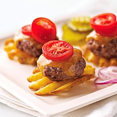 a hamburger and french fries on a white plate