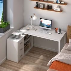 a white desk with a computer on top of it next to a bed and window