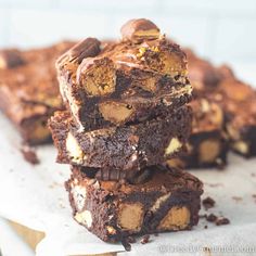 brownies stacked on top of each other with peanut butter and chocolate in the middle