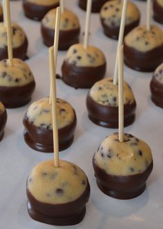 chocolate chip cookies and marshmallows are arranged on sticks