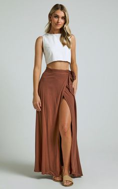 Get ready to turn heads in the Break A Leg Maxi Skirt! This wrap thigh split skirt in espresso is a showstopper. Made with luxurious rayon fabric, this maxi skirt is perfect for any casual occasion. The high waist and flattering silhouette will accentuate your curves and make you feel like a total babe. Pair it with a cute crop top or bodysuit for an effortlessly chic look that will have everyone asking where you got your style from. Don't be afraid to break some hearts while rocking this stunni Thigh Split Skirt, Break A Leg, Look Boho Chic, Stil Boho, Cute Crop Top, Tie Skirt, Wrap Maxi Skirt, Split Skirt, Brown Skirts