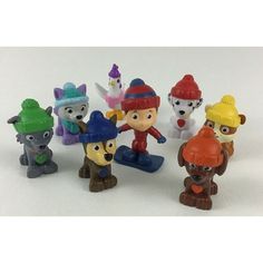 a group of small toy figurines sitting next to each other