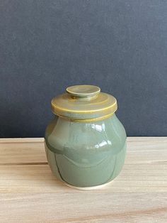 Enhance your home decor with this beautifully handcrafted jade/green lidded jar. Standing at approximately 4.5 to 5 inches tall with the lid, this charming jar combines functionality with artistic craftsmanship. The jar's opening measures almost 3 inches, making it perfect for storing small items or simply serving as a decorative accent. The jar features a stunning jade green glaze that exudes elegance and tranquility. While the bottom of the jar has some glaze imperfections, these are only visi Jars With Lids, Jam Jar, Jar Lids, The Jar, Art Ceramics, Jade Green, Fine Art Ceramics, Kitchen Stuff, Small Items