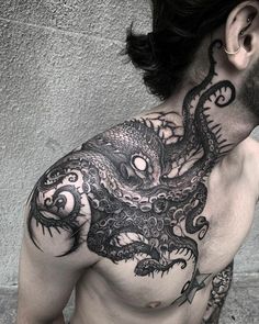 a man with an octopus tattoo on his chest