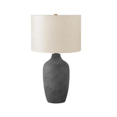 Bring some contemporary sophistication to any room with this stylish 27"h table lamp. A beautiful blend of a textured grey ceramic vase shaped base and beige linen shade, finished with a gold finial on top, this lamp is a great way to brighten any bedroom, living room or office. With a 3-way switch that houses a single bulb (not included) for a maximum output of 100W/120V, this lamp offers three levels of illuminating light for creating the ambiance you desire. Attached with a 5ft transparent co Grey Table Lamps, Grey Ceramics, Vase Shapes, Linen Shades, Finials, Ceramic Vase, Bedroom Living Room, Indoor Lighting, Side Table