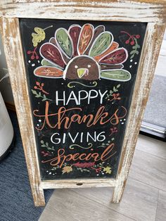 a chalkboard sign that says happy thanksgiving giving special