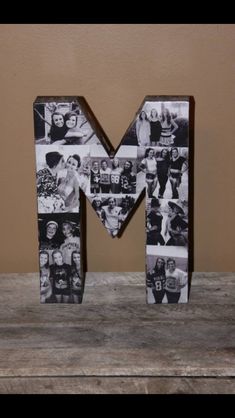 the letter m is made up of photos and letters that have been placed on top of each other