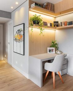 a home office with white walls and wooden shelves