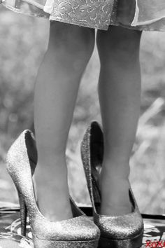 black and white photograph of woman's legs in high heels