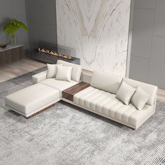 a large white sectional sofa sitting on top of a carpeted floor next to a fireplace