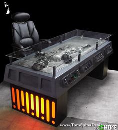 a futuristic desk with a chair in the middle and an illuminated table top on it