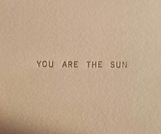 an old typewriter with the words you are the sun printed on it's paper