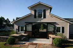 the front entrance to a home with stone steps leading up to it