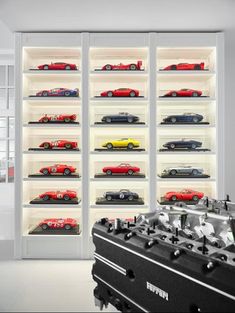 a display case filled with lots of toy cars