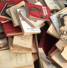 a pile of old books sitting on top of each other