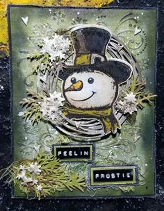 a close up of a card with a snowman wearing a hat and top hat