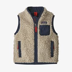 The Patagonia Baby Retro-X® Vest in Natural w/ New Navy provides windproof warmth in soft ½"-pile fleece that’s made of 100% recycled polyester. Fair Trade Certified™ sewn. 100% recycled polyester fleece; windproof lining has PFC-free DWR finish (durable water repellent chemistry that does not contain perfluorinated chemistry) Tapered collar to prevent chafing Nylon/spandex binding at collar, center-front zipper, armhole openings and hem for a secure fit Chest pocket; two welt-covered, zippered Retro Patagonia, Patagonia Baby, Patagonia Retro X, Patagonia Retro, Baby Patagonia, Toddler Outdoor, Patagonia Vest, Patagonia Kids, Infant Boys