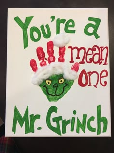 a handprinted sign that says, you're a human one mr grin