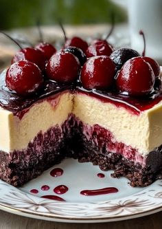 a piece of cheesecake with cherries on top