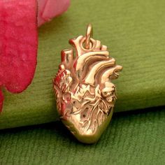 Rose Gold Charm - Anatomical Heart with 18K Rose Gold Plate, Organ Charms, Science, Love, Doctor, Nurses, Gifts, Anatomy, Medical Student This realistic heart features lifelike details - from the four chambers to the arteries and veins. Find more Heart Charms and Bone Charms. Our vermeil style gold plate is 40 micro inches of 98.5% pure gold plated over sterling silver with a fine layer of nickel in between. For Rosegold, we add a thin layer of 18K Rosegold, finished with a nanopolymer coating t Realistic Heart, Nurses Gifts, Love Doctor, Arteries And Veins, Rose Gold Plate, Rose Gold Charms, Cleaning Silver Jewelry, Anatomical Heart, Monogram Jewelry