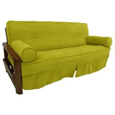 a green futon couch sitting on top of a wooden frame