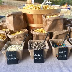 bags filled with popcorn sitting on top of a table