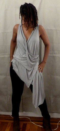 Gray drape top is one of my new tops. You can wear a sports bra under,bikini top,tank top. If you would like the arm hole smaller, please let me know. I love draping tops, because they are stylish for any age,funky,chic and fun to wear. You can wear leggings,skinny jeans or over any plain dress or skirt. The fabric in the picture is rayon Lycra (light weight). I can also make it in ity jersey which is wrinkle free and easy to care for. Every piece of clothing in my shop is made and designed by m Chic Tops With Built-in Bra For Layering, Chic Sleeveless Top With Built-in Bra, Gray Stretch Tops For Summer, Drapey Asymmetrical Summer Tops, Versatile Fitted Draped Top, Versatile Draped Summer Top, Drapey Party Top, Fitted Sleeveless Tops For Loungewear, Stretch Summer Blouse In Gray