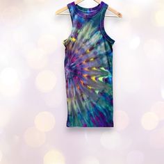 This is a beautiful, colorful mini dress, hand dyed by me in bright rainbow shades against deep grays and black. This dress is designed to fit close to the body and could fit a variety of sizes, depending on how fitted you prefer to wear it. It is soft, stretchy, and comfy! The fabric is a substantial rib-knit, with ribbed sleeveless cuffs and crew neck collar. CARE AND MATERIALS 96% cotton, 4% spandex. Machine wash cool and tumble dry low or hang to dry to extend the lifespan of the dress. I ha Summer Tie-dye Dress With Natural Dye, Flowy Hand-dyed Tie-dye Dresses, Casual Hand-dyed Tie Dye Maxi Dress, Spring Hand-dyed Tie-dye Dresses, Casual Hand-dyed Tie-dye T-shirt, Fitted Mini Dress, Deep Gray, Tie Dye Dress, Ice Dyeing