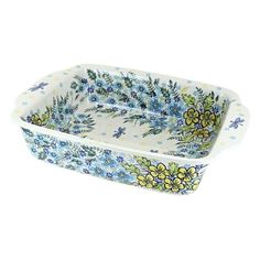 a rectangular dish with blue and yellow flowers on it