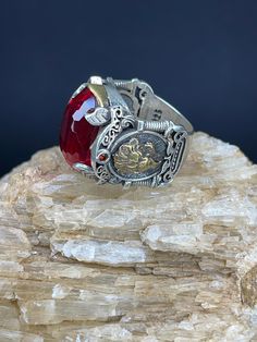 Red Zircon With Lion Figured Silver Men's Ring | Handmade | 20g | Free Shipping 🔹 Discover the allure of our handcrafted Zircon Stone ring, designed for those who appreciate elegance and sophistication. This remarkable men's ring, weighing a solid 20 grams, features a dazzling Zircon gemstone that captures and reflects light in a mesmerizing array of colors. 🔹 Key Features: *Material: Premium Silver *Gemstone: Zircon *Weight: 20 grams *Design: Handcrafted for unique beauty *Guarantee: 1 year ? Collectible Red Engraved Ring, Antique Red Gemstone Signet Ring, Red Garnet Signet Ring For Anniversary, Collectible Ruby Ring With Polished Finish, Silver Ruby Rings For Collectors, Collectible Red Rings With Polished Finish, Antique Red Rings For Gifts, Antique Red Rings For Gift, Red Ruby Gemstones With Accent Stones